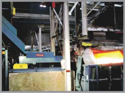 Scrap Discharges Onto A Swivel Chute That Feeds Furnace Feeders| Prab.com