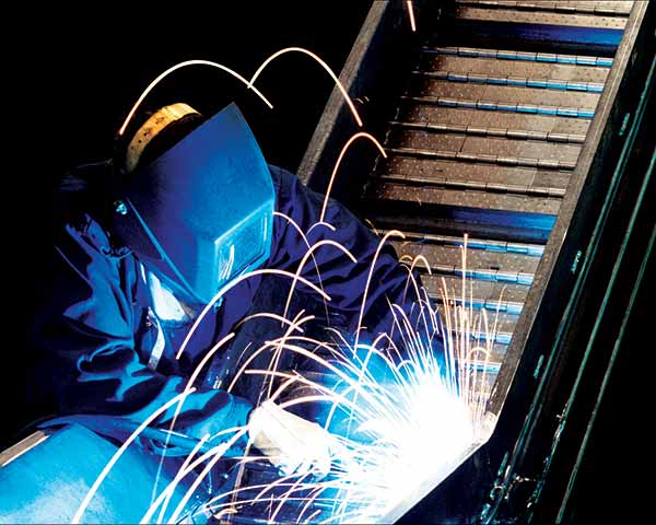 Lobby Welder Working On Steel Metal Belt Conveyor