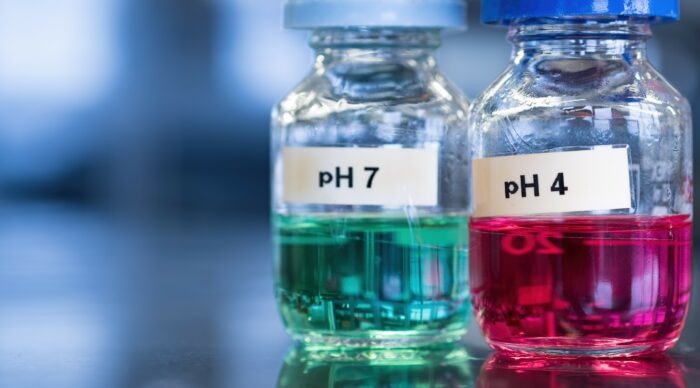 Two Liquid Jars with pH Numbers